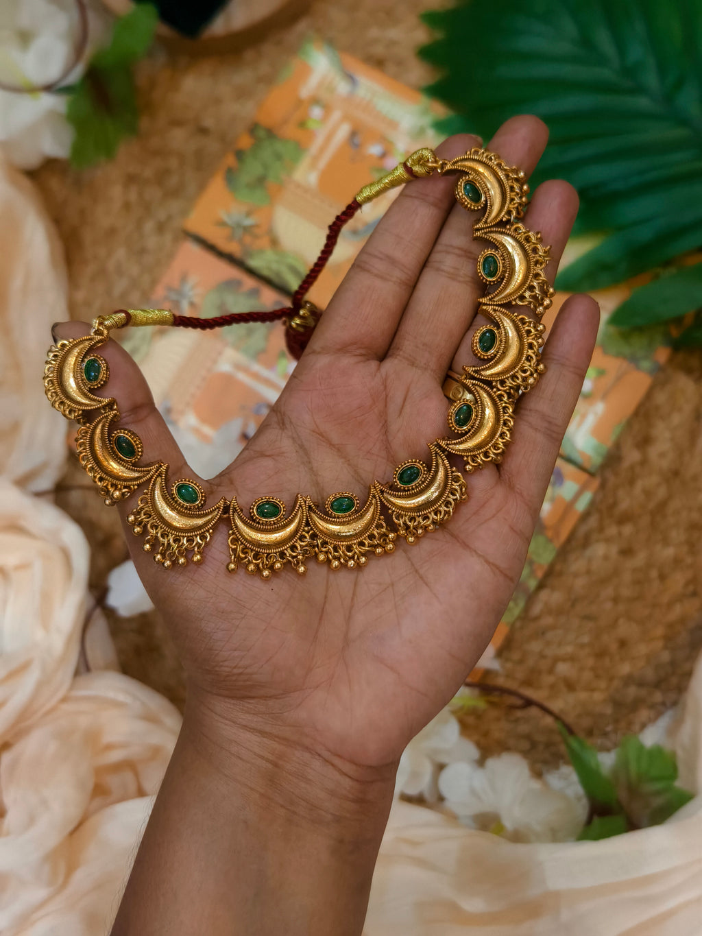Moon with golden beads
